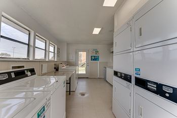 Community laundry room with washers and dryers